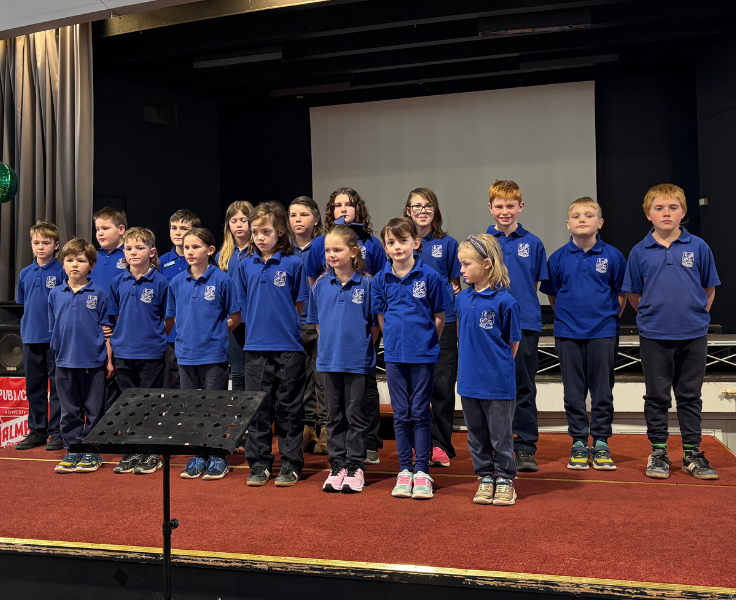 White Cliffs Public School singing on stage at Choral Festival